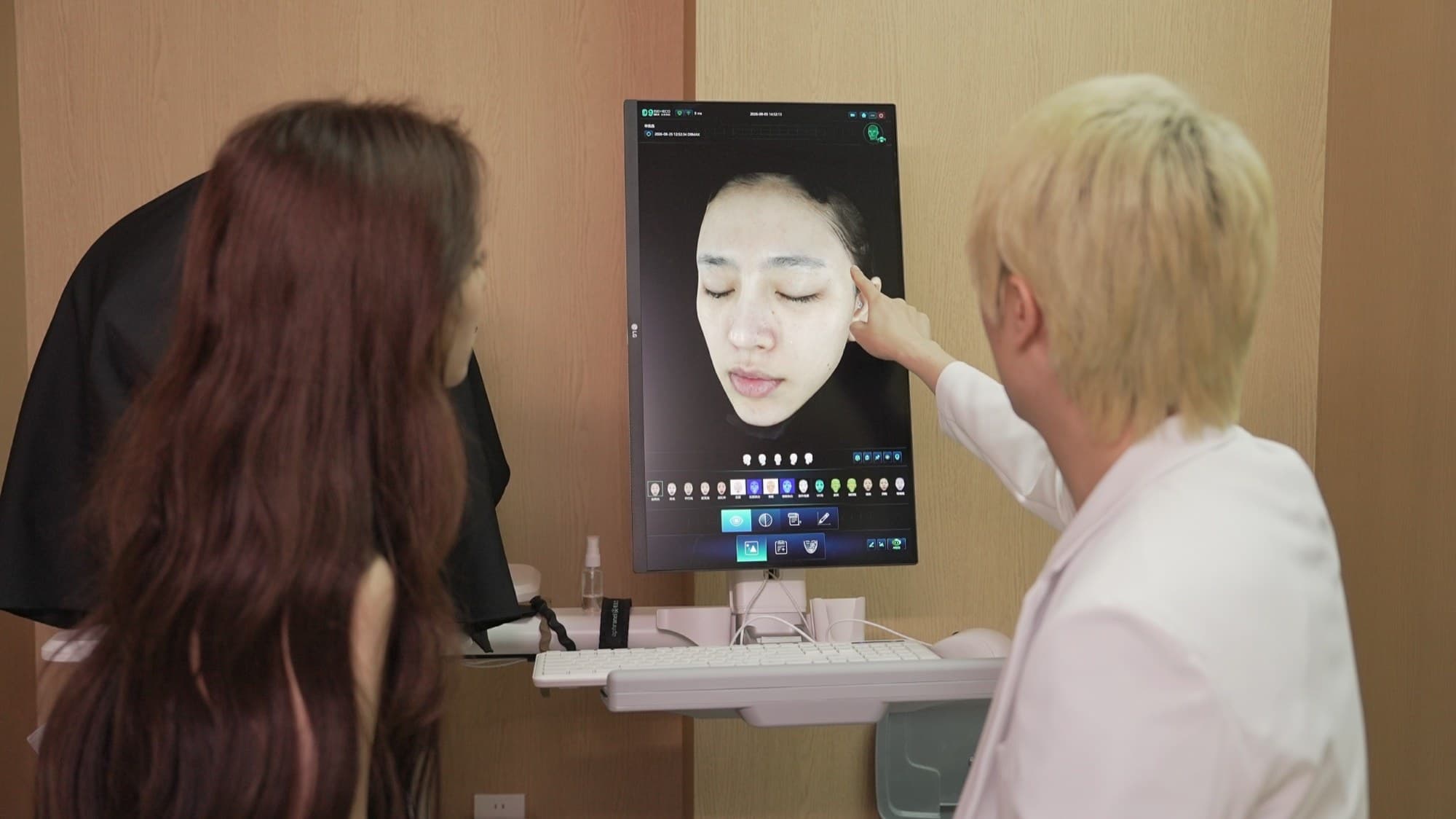 Dr. Lancho reviewing a diagnostic facial scan during a consultation